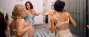Close up of dancers in vintage underwear and swimsuits in the changing room of a public swimming pool